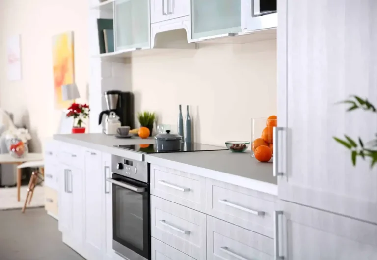 Modern white kitchen remodel with new cabinetry and countertops